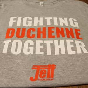 solid gray t-shirt with fighting duchenne together text, fighting written in white, duchenne written in red, together written in white, with the jett logo written underneath in red