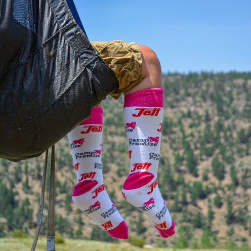 Pink and white socks with pink jett logo and pigasus pattern